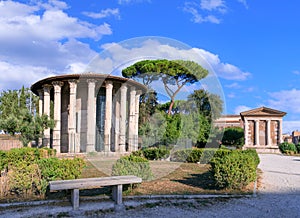 Urban view of Rome: the circular Temple of Ercules Victor near the small rectangular  Temple of Portunus in the Forum Boarium, Ita photo